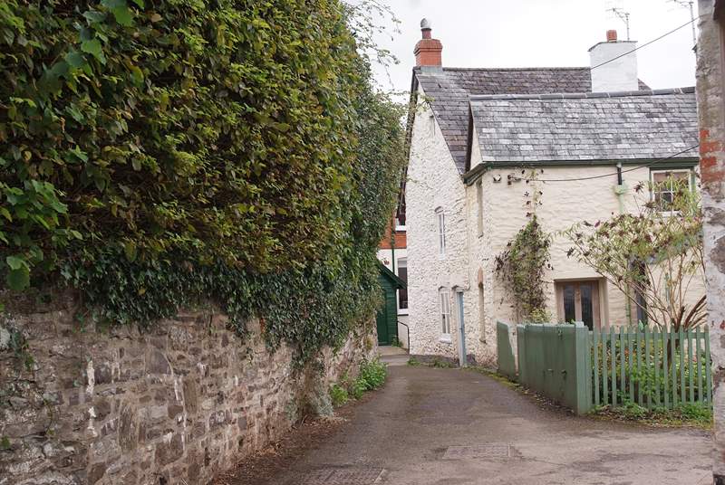 This is the entrance to Rosemary Lane. Lane Cottage is off a tiny square with private parking at the end of the lane.