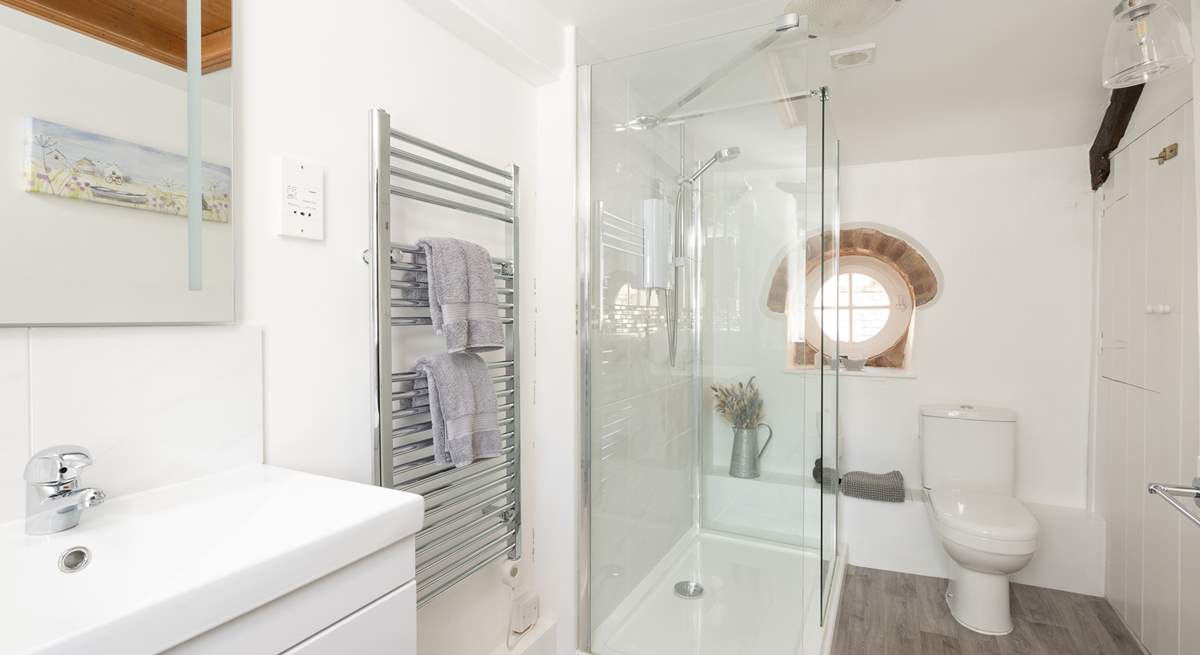 The modern shower-room is bright and spacious.