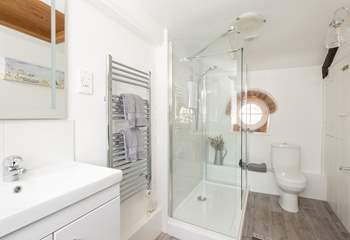 The modern shower-room is bright and spacious.