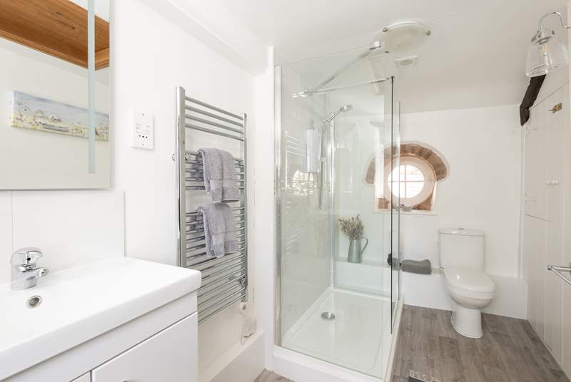 The modern shower-room is bright and spacious.