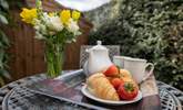 Treat yourself to breakfast on the sunny patio. - Thumbnail Image