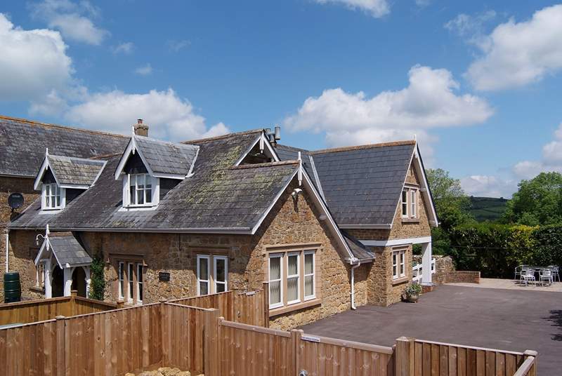 This photograph shows the overall setting. The Old School Gables is to the right, with its own parking and enclosed private outside area.
