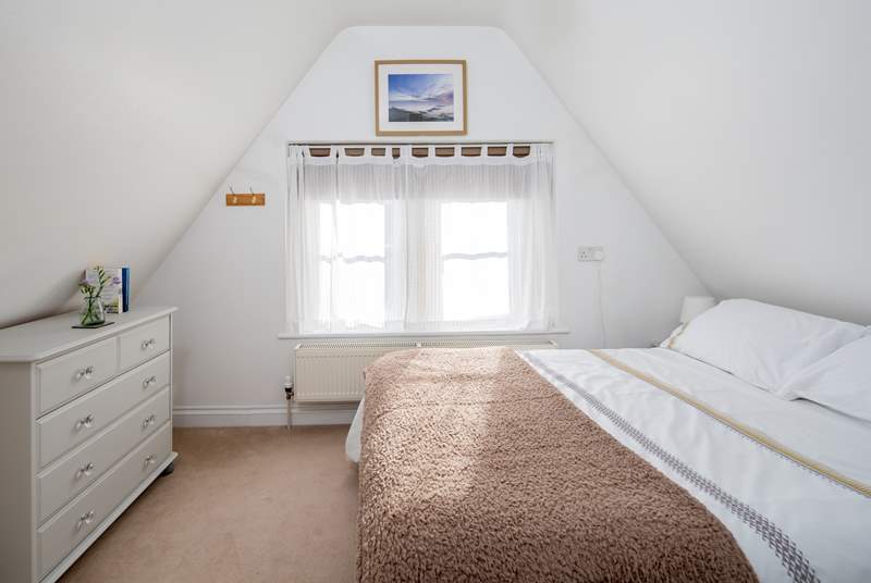 Bedroom 2 has a characterful sloping ceiling - and therefore a slightly lower than a standard 4ft 6' double bed.