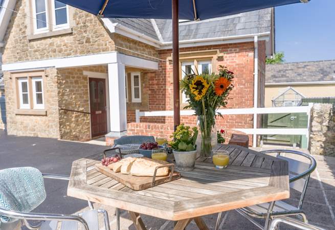 One end of the original playground has been made into a sheltered and sunny patio.