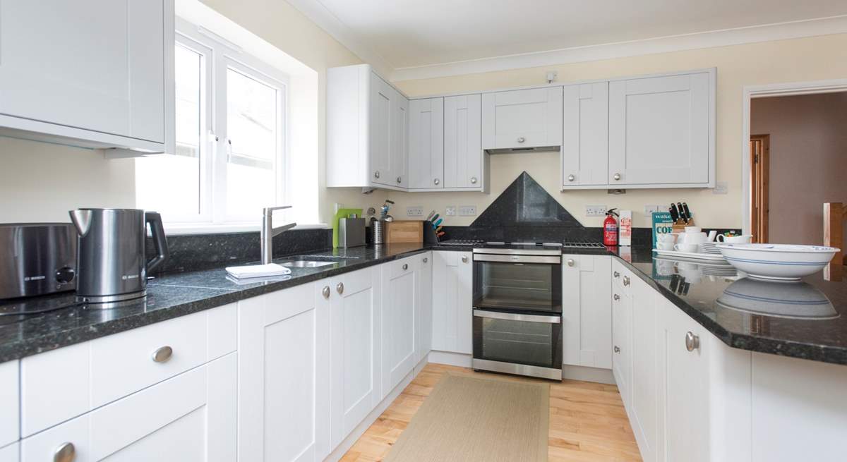 Well-equipped and spacious, the bright and airy kitchen.