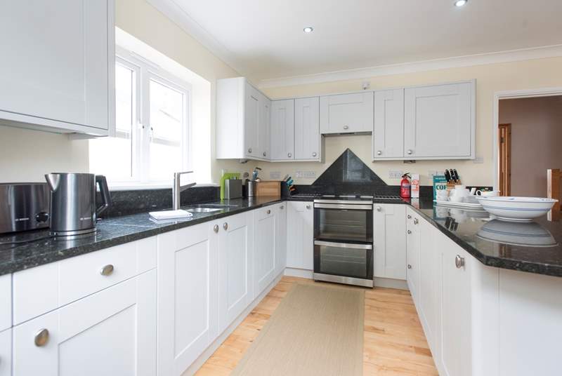 Well-equipped and spacious, the bright and airy kitchen.