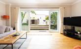 Doors open onto the decked terrace. - Thumbnail Image