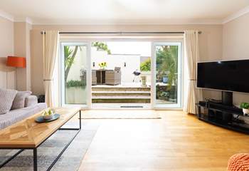 Doors open onto the decked terrace.