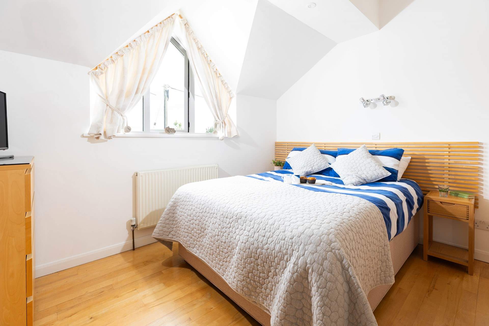 Bedroom 1 is a cosy double with a separate dressing area and an en suite shower-room.