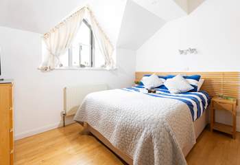 Bedroom 1 is a cosy double with a separate dressing area and an en suite shower-room.