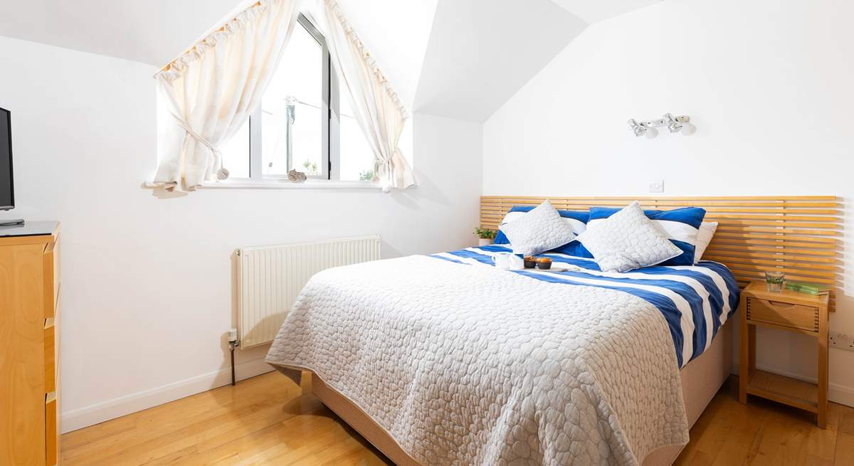 Bedroom 1 is a cosy double with a separate dressing area and an en suite shower-room.