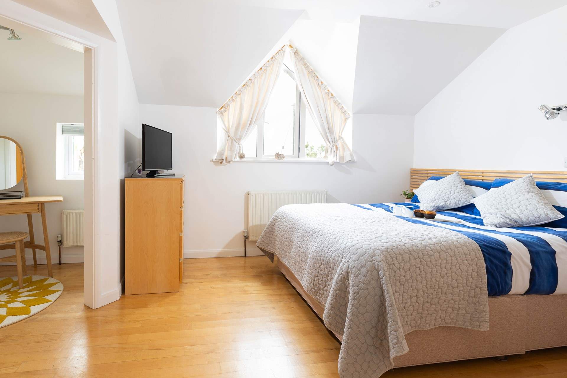 Large bedroom 1 offers privacy and comfort.