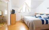 Large bedroom 1 offers privacy and comfort. - Thumbnail Image