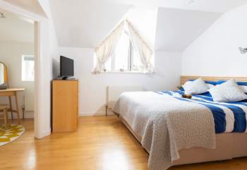 Large bedroom 1 offers privacy and comfort.