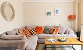 Snuggle up on the sofa. - Thumbnail Image