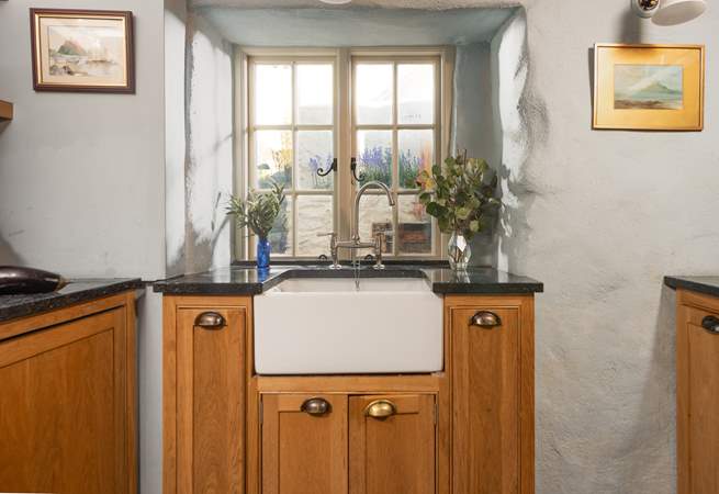 The cottage style kitchen has a Belfast sink.