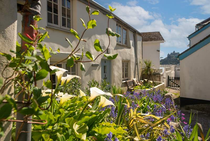 Peeping in between the cottages you can see magical St Michael's Mount.