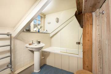 The family bathroom has a bath with fitted shower.
