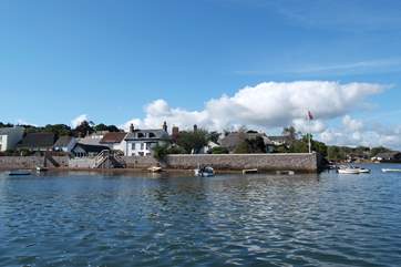 The waterfront garden and summerhouse is at the left end of the wall in the photograph.