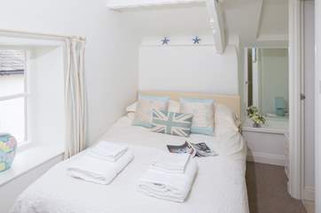Bedroom 2 is at the front of the cottage and has an en suite shower and wash-basin.
