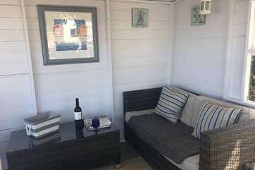 A cosy sofa in the summer-house for those chillier days.