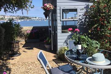 Dining al fresco in this charming waterside garden is always going to be a pleasure.