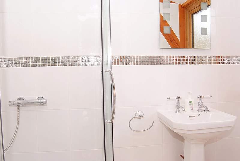 The excellent sized en suite is bright and contemporary.