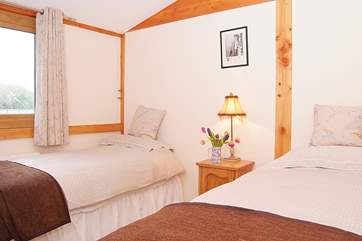 The twin room offers plenty of space for adults as well as children.