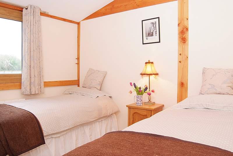 The twin room offers plenty of space for adults as well as children.