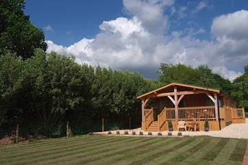 There is now a hot tub to the left of the veranda!