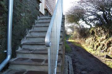 Steps access the cottage and the adjoining footpath leads up to the top of the Beacon.