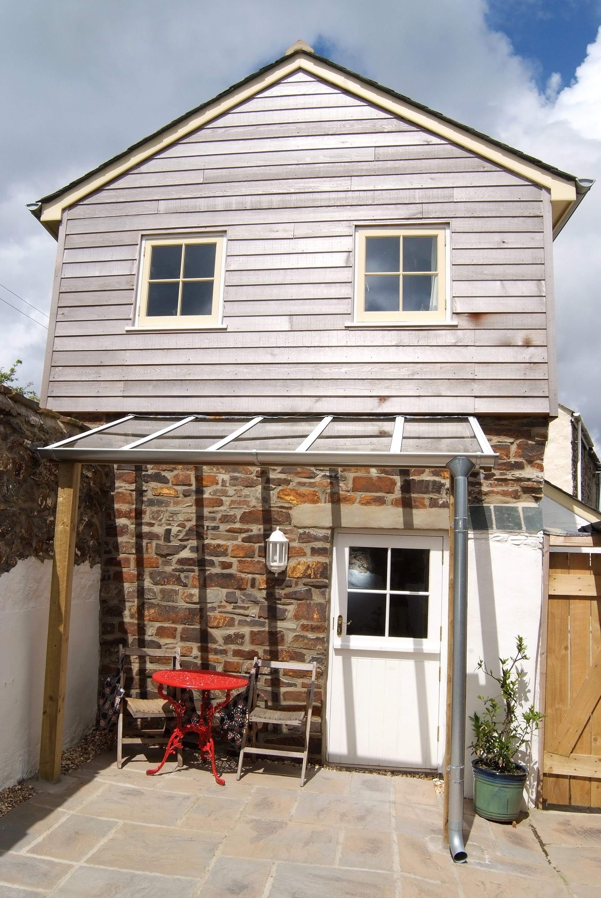 The rear patio-area is enclosed and a real sun-trap.