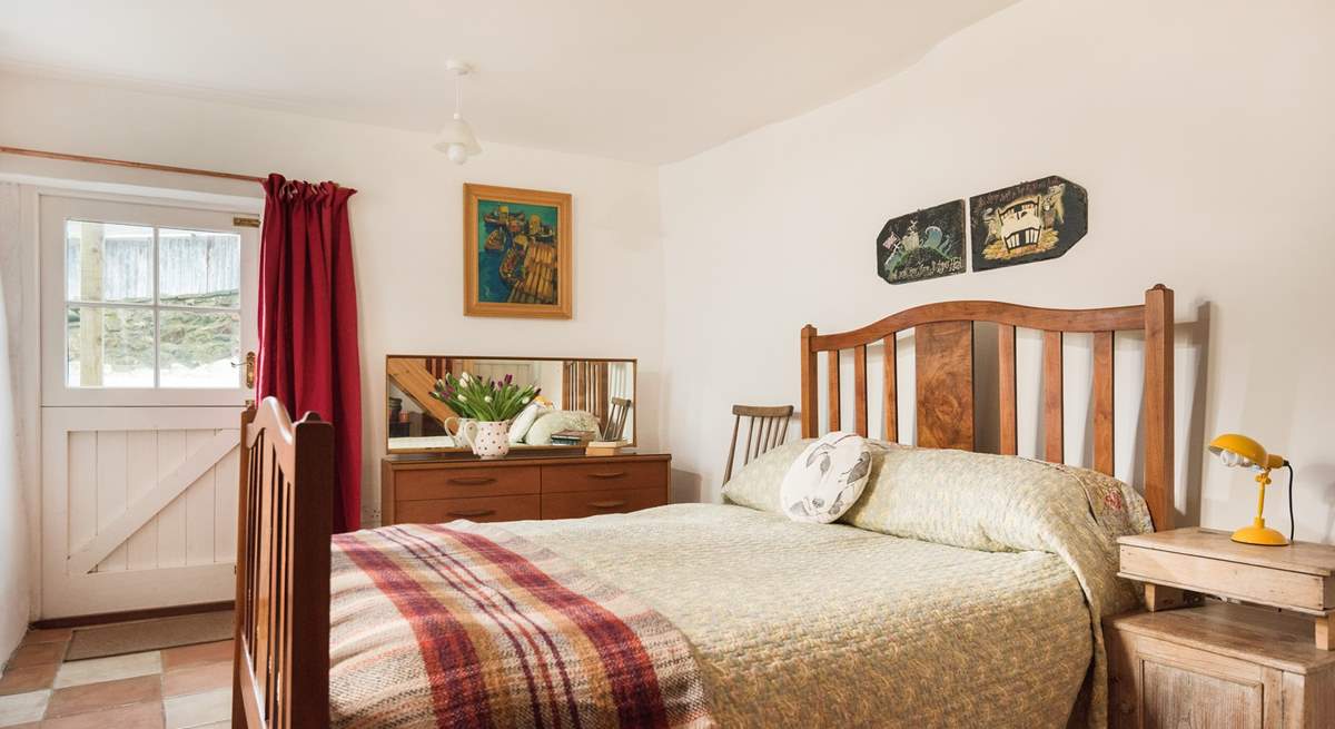 The ground floor bedroom has a gorgeous antique double bed frame, with a John Lewis eco mattress.