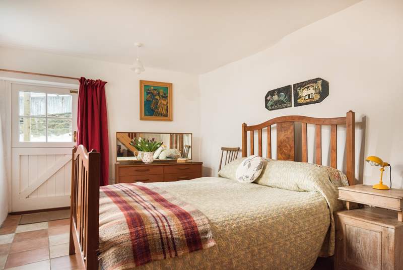 The ground floor bedroom has a gorgeous antique double bed frame, with a John Lewis eco mattress.