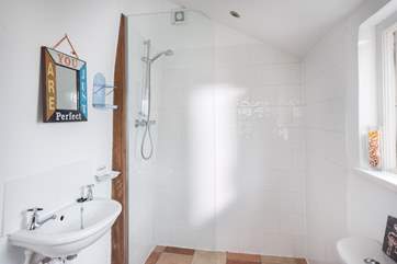 A walk-in shower with under-floor heating.