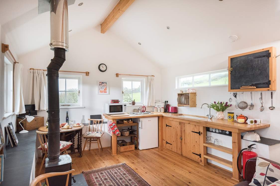 The open plan living-room is full of handmade furnishings and wonderful artwork.