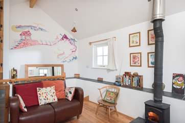 The mural on the staircase wall shows the footpath around the Beacon to St Agnes.