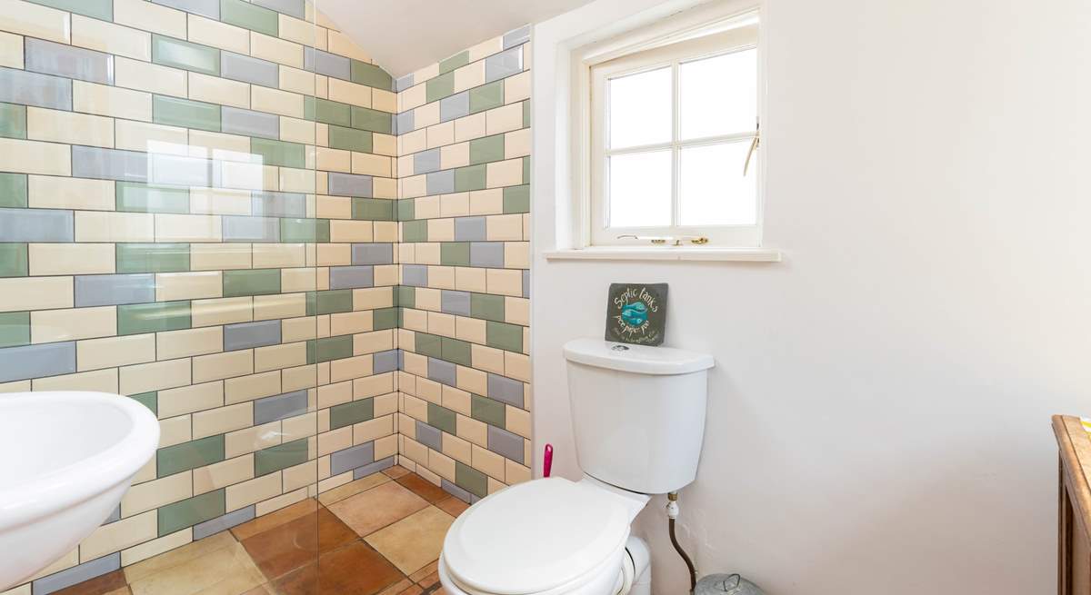 A walk-in shower with under-floor heating.