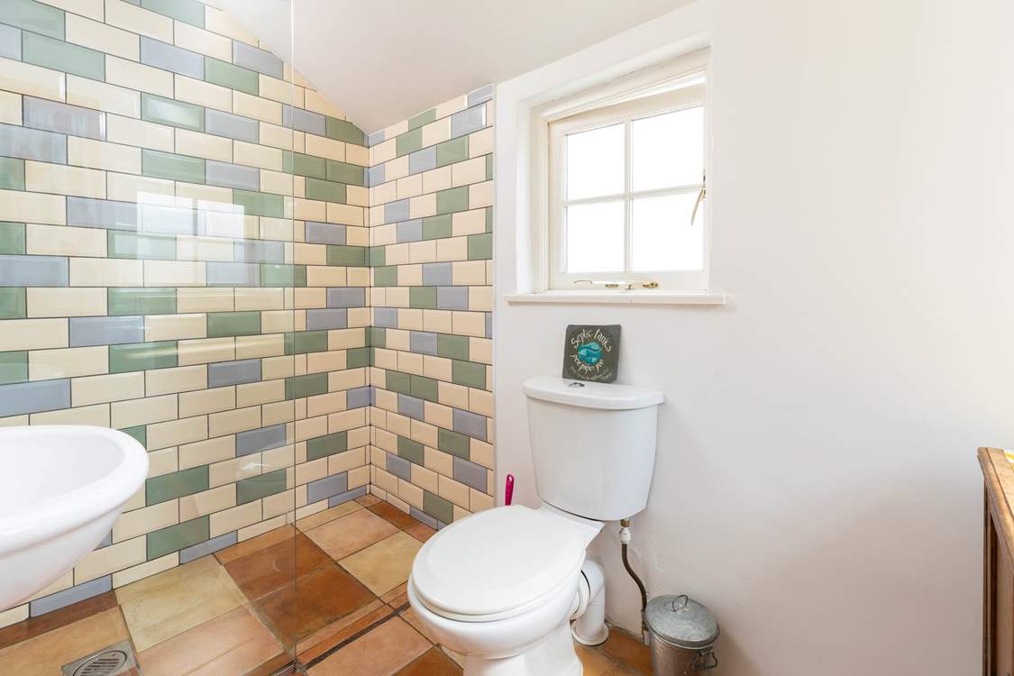 A walk-in shower with under-floor heating.