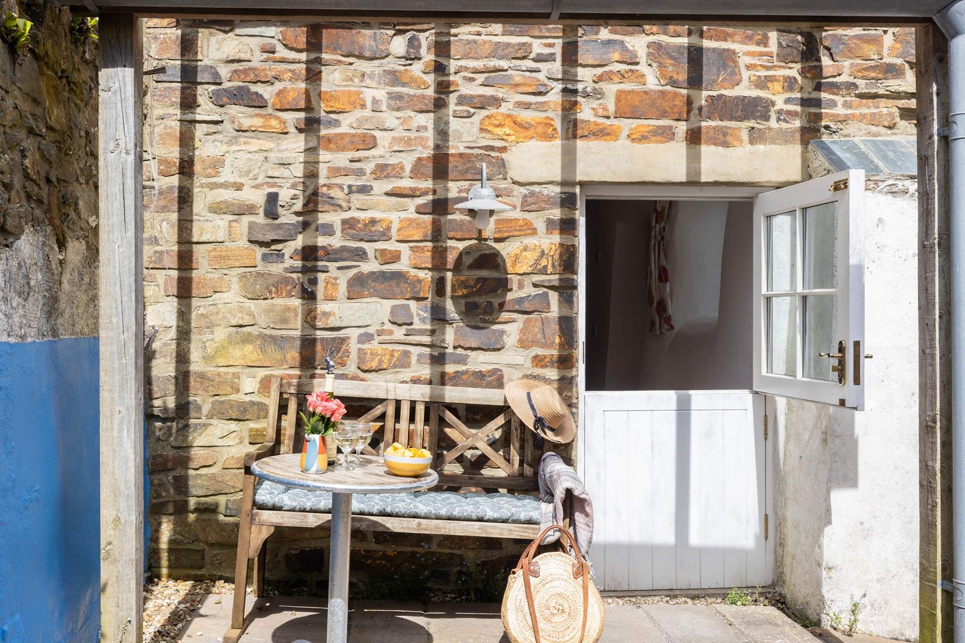 A sheltered and sunny courtyard opens from the bedroom.
