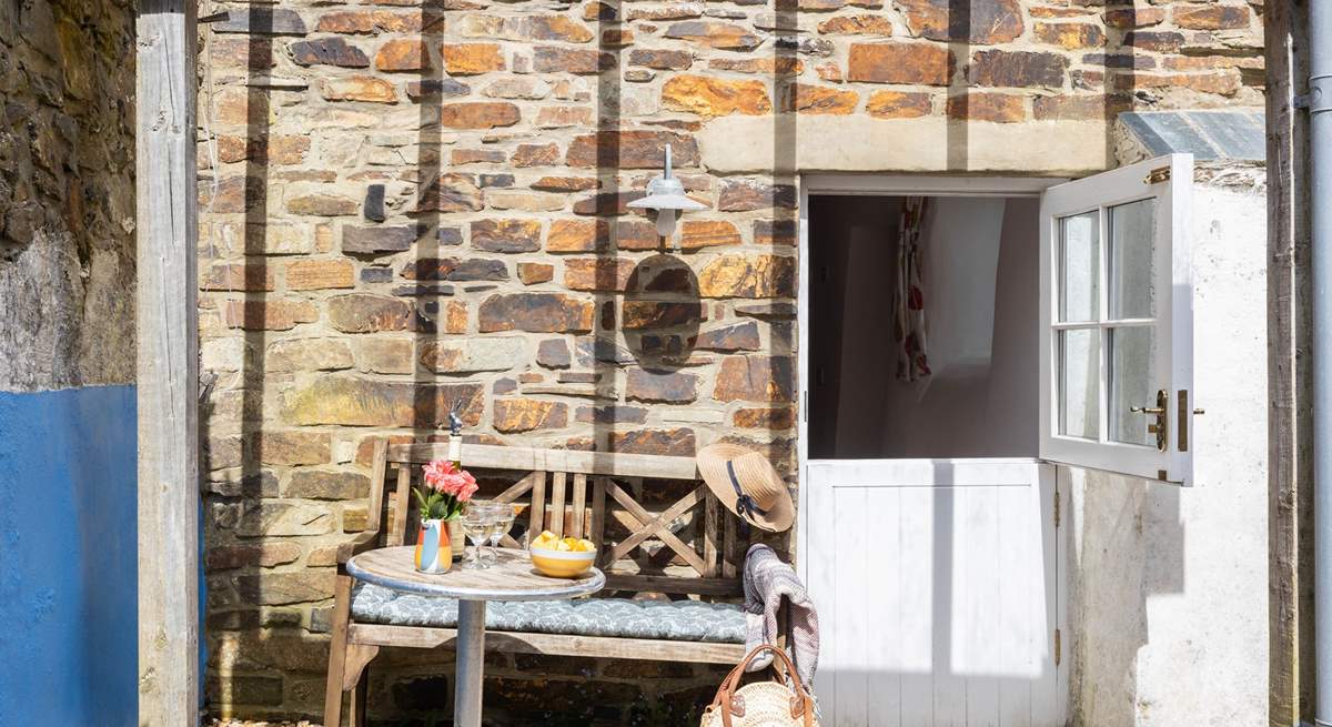 A sheltered and sunny courtyard opens from the bedroom.