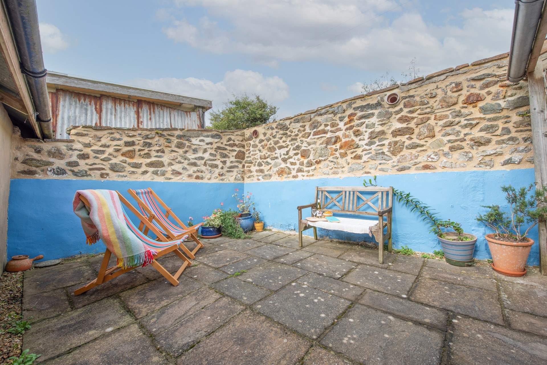 A private sheltered courtyard for morning coffee and evening drinks.