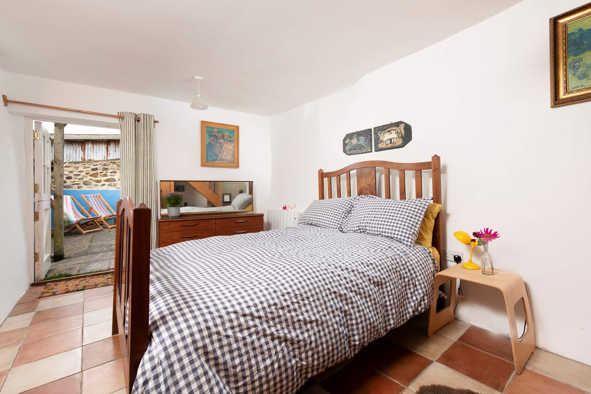 The ground floor bedroom has a gorgeous antique double bed frame, with a John Lewis eco mattress.
