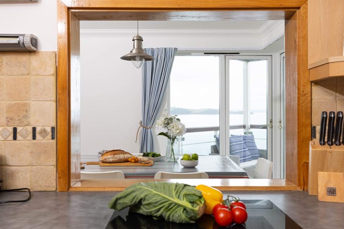 The hatchway looks through to the dining-room and the view.