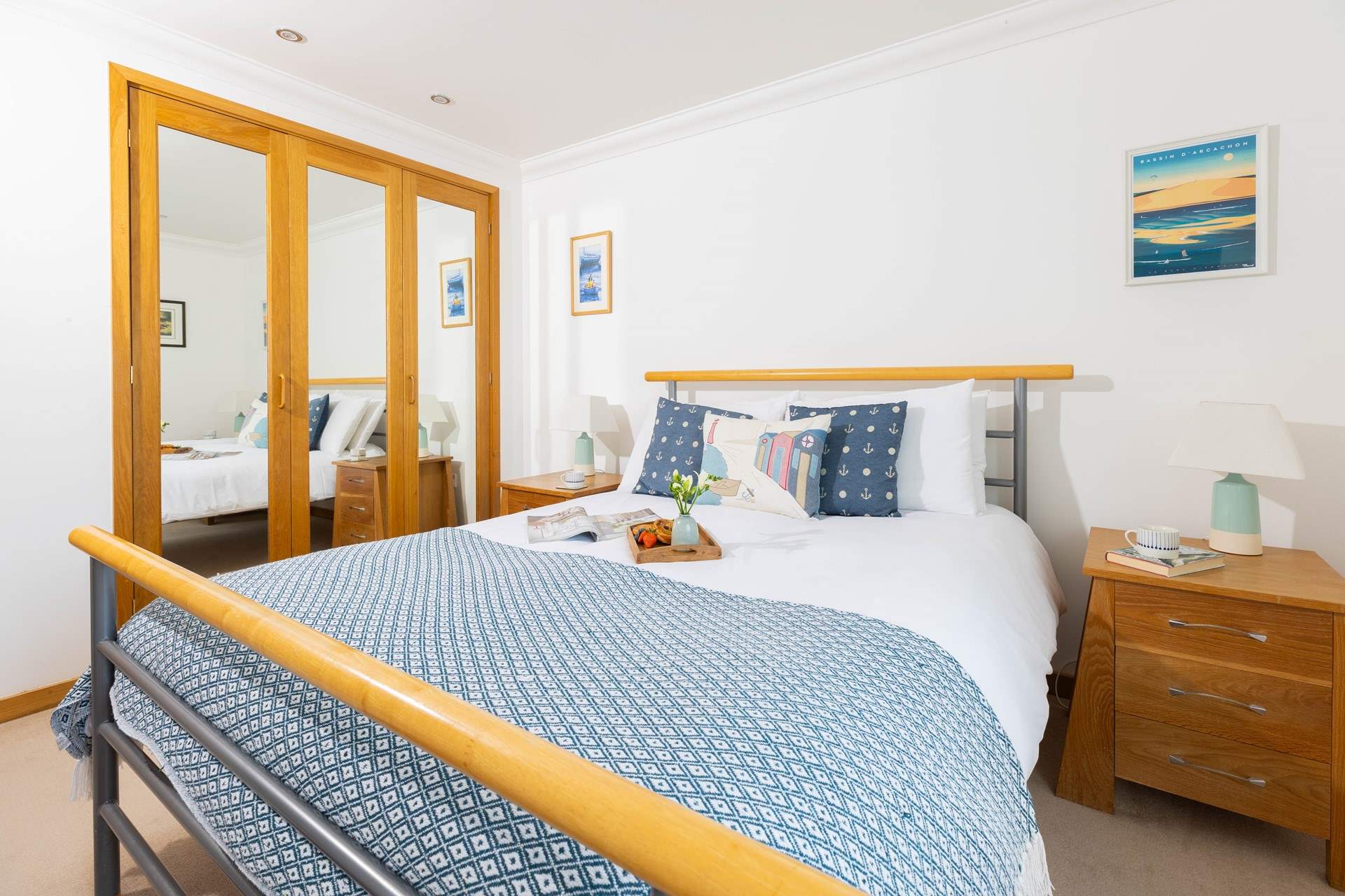 Mirrored wardrobes reflect plenty of light in Bedroom 2.