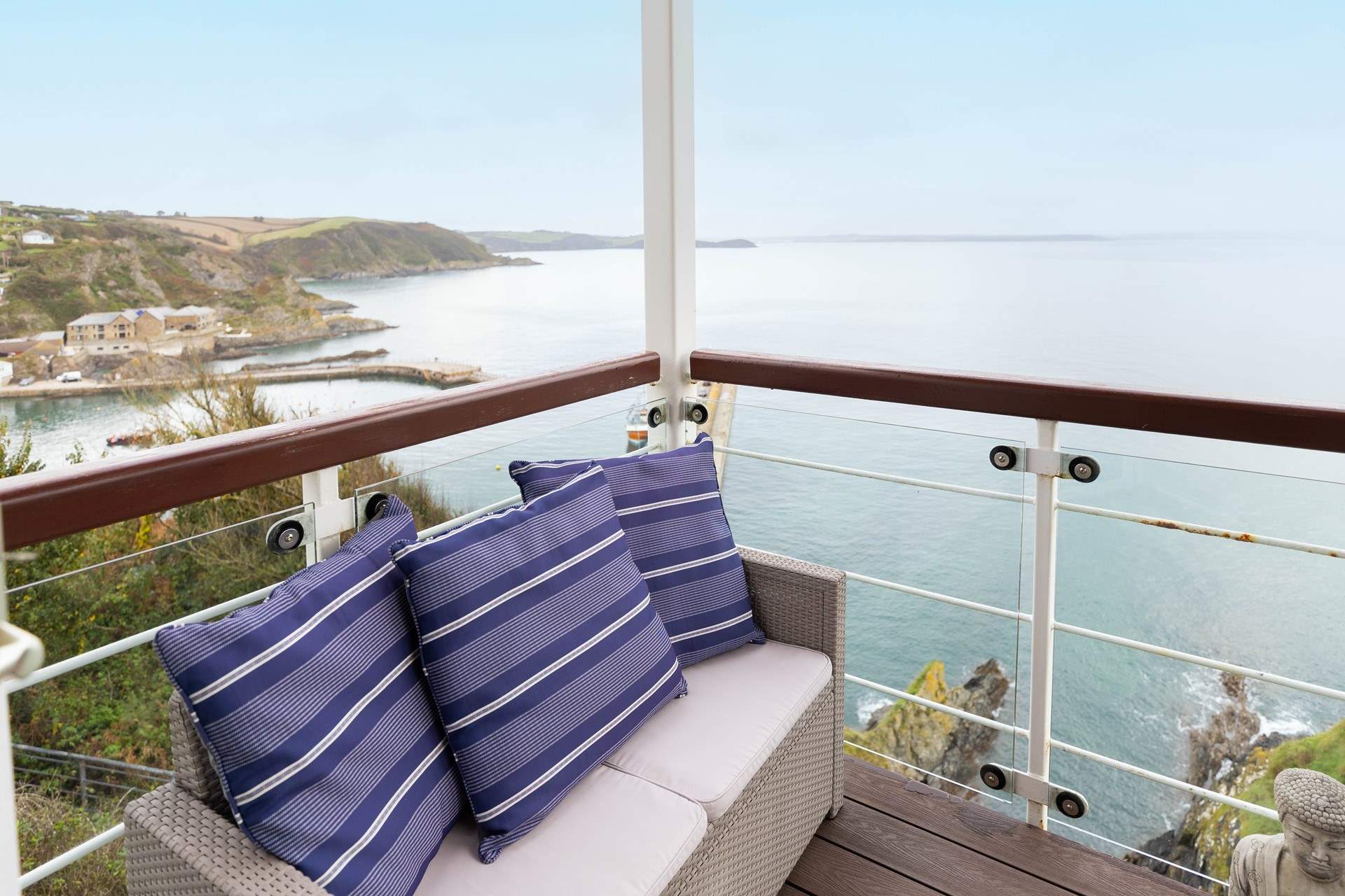 The covered balcony provides a grandstand view of Mevagissey harbour and bay.