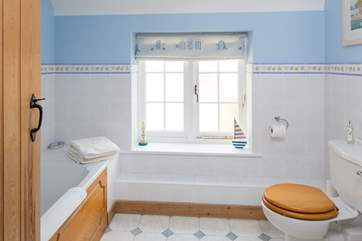 A seaside theme gives the family bathroom a holiday feel.