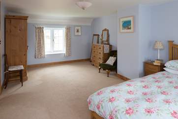 The master bedroom (Bedroom 1) is exceptionally spacious. Dual-aspect windows allow the light to flood in.