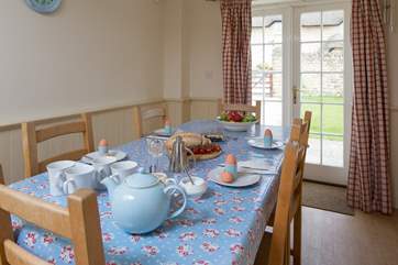 French doors lead from the kitchen/dining-room to the enclosed rear garden.