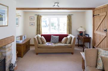 Two comfy sofas and fireside chairs in the sitting-room make it the perfect place to relax after a day of adventure.
